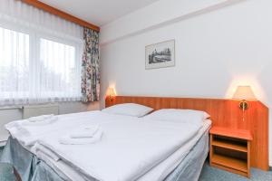 Letto o letti in una camera di Hotel Astra