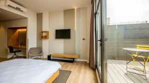 TV a/nebo společenská místnost v ubytování La Cappella Business Boutique Hotel