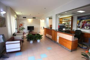 a lobby of a hospital with a bar and a waiting room at Hotel San Nazario in Varazze