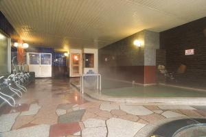 a swimming pool in a large room with a pool at Hotel Grand Toya in Lake Toya