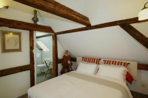 מיטה או מיטות בחדר ב-Chambres d'Hôtes La Stoob Strasbourg Sud