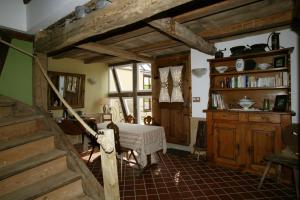 a bedroom with a bed in a room with wooden ceilings at Chambres d'Hôtes La Stoob Strasbourg Sud in Illkirch-Graffenstaden