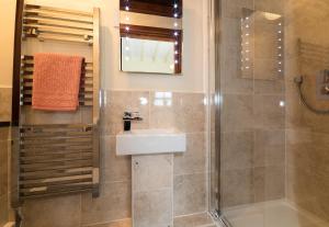 a bathroom with a sink and a shower at Conwy Valley Cottages in Conwy +92 photos