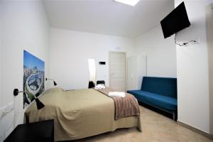 Postel nebo postele na pokoji v ubytování Into Palermo B&B