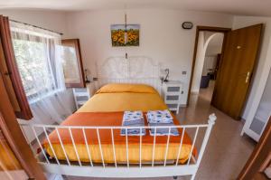 A bed or beds in a room at Casa Vacanze "Ro & Se" a Palinuro IT, Bandiera Blu anche per il 2025