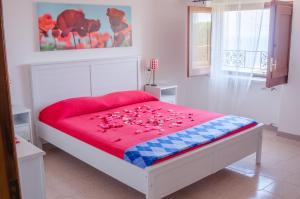 A bed or beds in a room at Casa Vacanze "Ro & Se" a Palinuro IT, Bandiera Blu anche per il 2025