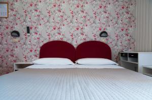 Postel nebo postele na pokoji v ubytování Hotel Eden