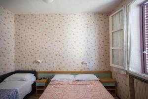 Postel nebo postele na pokoji v ubytování Hotel Eden