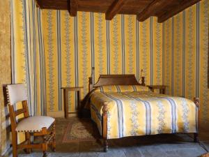 Postel nebo postele na pokoji v ubytování Auberge de l'Abbatiale