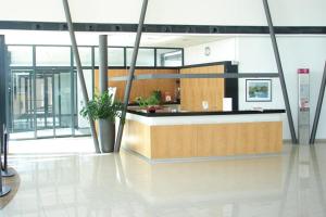 a lobby with a reception desk in a building at Hotel der Rastanlage im Hegau OST in Engen