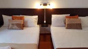 Cama ou camas em um quarto em Guesthouse of Alcobaça