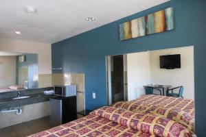 Giường trong phòng chung tại Florentina Motel - Los Angeles