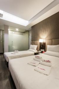 Postel nebo postele na pokoji v ubytování Hotel Trillium