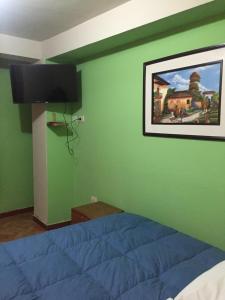 Postel nebo postele na pokoji v ubytování Rumi Sonqo Hostel