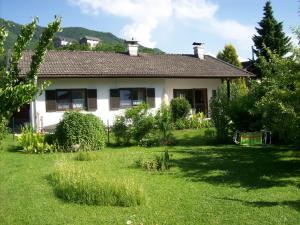 a house with a yard in front of it at Ferienhaus Irger in Marquartstein