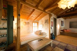 a room with a bed and a bench in a room at Art Provence House in Lozenets