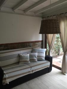 Postel nebo postele na pokoji v ubytování Ala Garden Apartment