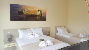 Postel nebo postele na pokoji v ubytování Guesthouse Laterna