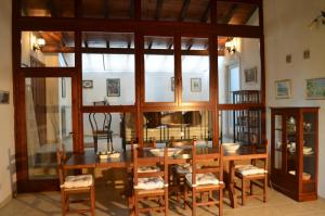 a dining room with a table and chairs at Casa Sorgente in Montefiascone