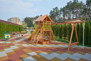 a playground with a slide and a play structure at City Holiday Resort & SPA in Kyiv