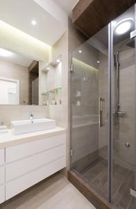a bathroom with a sink and a shower at Vivio Luxury Apartment in Belgrade +33 photos