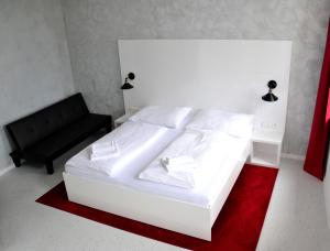 Voodi või voodid majutusasutuse Hotel Drnholec toas
