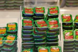 a display of baby food in green plastic containers at Premiere Classe Orleans Nord - Saran in Saran