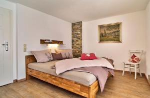 a bedroom with a bed in a room at Ferienhof Stetter in Schöllnach