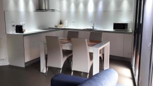 A kitchen or kitchenette at Apartaments y Habitacions Entre Volcans