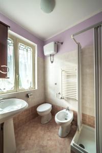 a bathroom with a toilet and a sink and a shower at Locanda Belvedere Da Stefano in Rocchetta a Volturno +39 photos