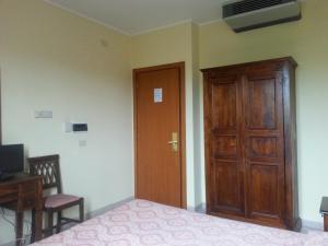 TV a/nebo společenská místnost v ubytování Hotel Tempio di Apollo