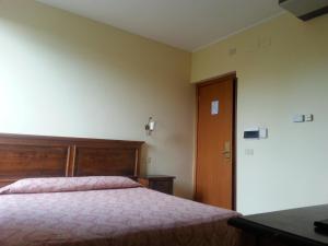 Ліжко або ліжка в номері Hotel Tempio di Apollo