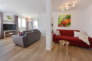 TV a/nebo společenská místnost v ubytování Ferienwohnung Sonnenschein + 4 fotografie