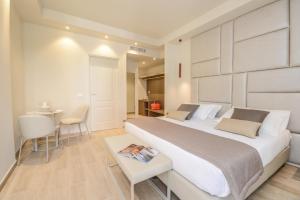Posteľ alebo postele v izbe v ubytovaní Hotel Villa Garuti