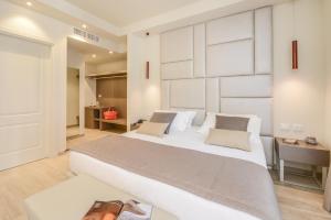 Posteľ alebo postele v izbe v ubytovaní Hotel Villa Garuti