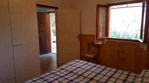 Postel nebo postele na pokoji v ubytování Agriturismo Rebua