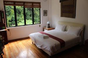Кровать или кровати в номере Nanga Damai Homestay