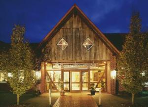 a building with a sign on the front of it at Landhotel Hermannshöhe in Legden