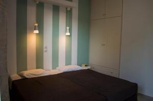 Postel nebo postele na pokoji v ubytování Nireas Hotel