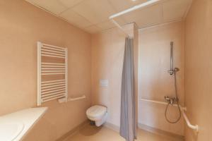 a bathroom with a toilet and a shower at City Résidence Marseille in Marseille