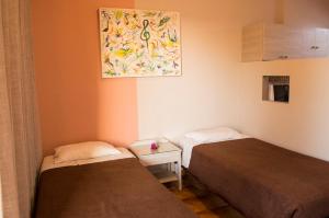 Postel nebo postele na pokoji v ubytování Nireas Hotel