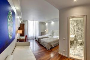 A bed or beds in a room at Hotel Vittoria