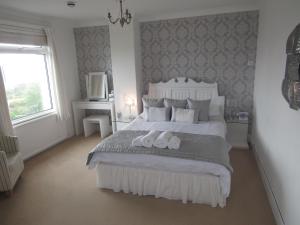 Postel nebo postele na pokoji v ubytování Tremarne Hotel