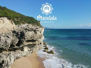 a view of the ocean from a rocky beach at Mandala Bungalows - Adults Only in Los Caños de Meca