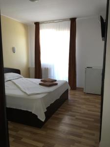 Postel nebo postele na pokoji v ubytování Vila DG