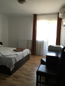 Postel nebo postele na pokoji v ubytování Vila DG