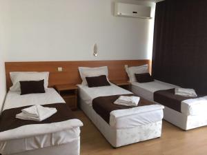 Postel nebo postele na pokoji v ubytování Dreams Family Hotel