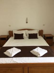 Postel nebo postele na pokoji v ubytování Dreams Family Hotel