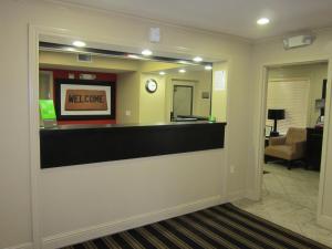 a lobby with a reception counter with a mirror at Extended Stay America Suites - Fremont - Fremont Blvd South in Warm Springs District