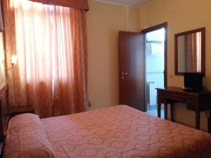 Ліжко або ліжка в номері Hotel Tempio di Apollo